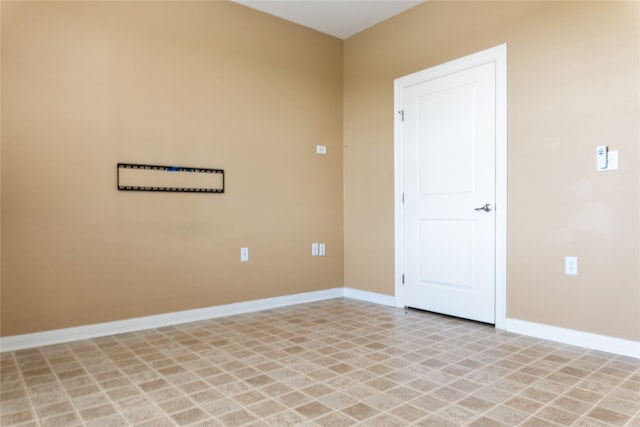 unfurnished room featuring light tile patterned floors