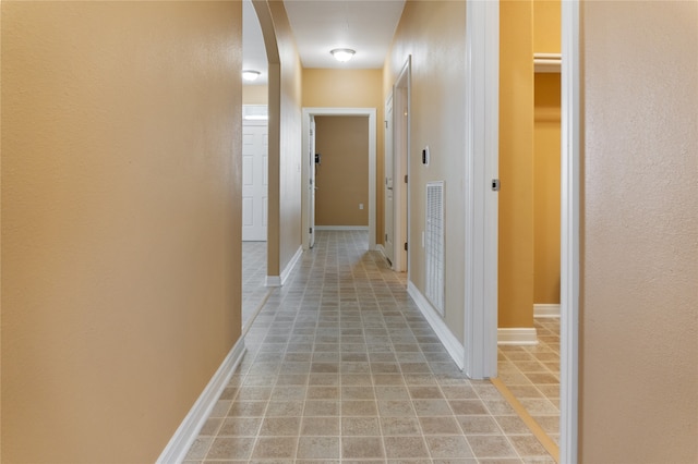 corridor featuring tile patterned flooring