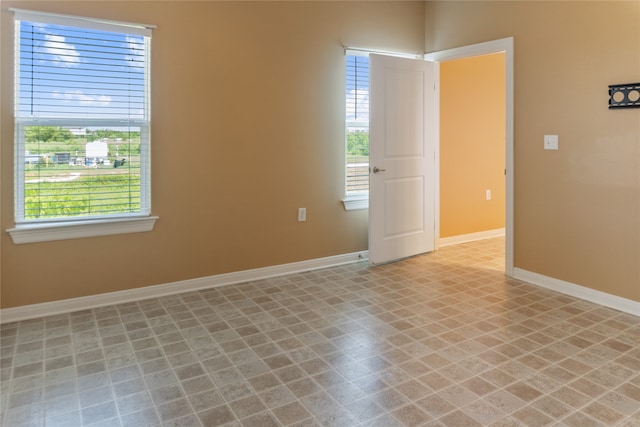 empty room featuring tile patterned flooring