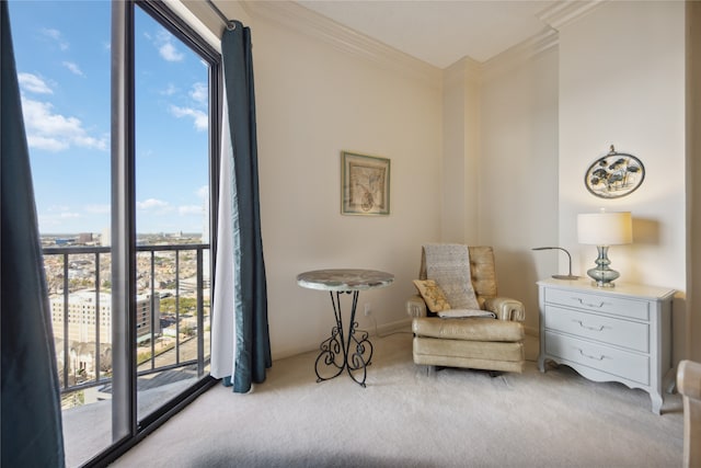 sitting room featuring crown molding and light colored carpet