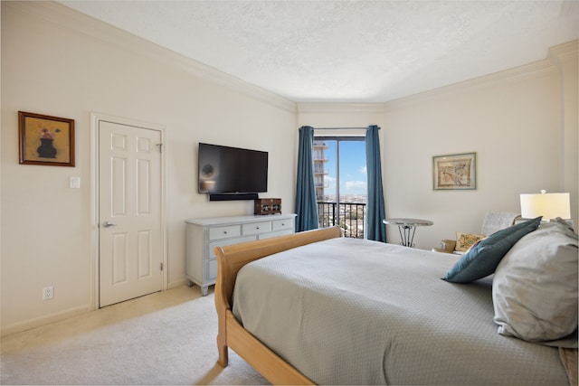 carpeted bedroom with access to outside, ornamental molding, and a textured ceiling