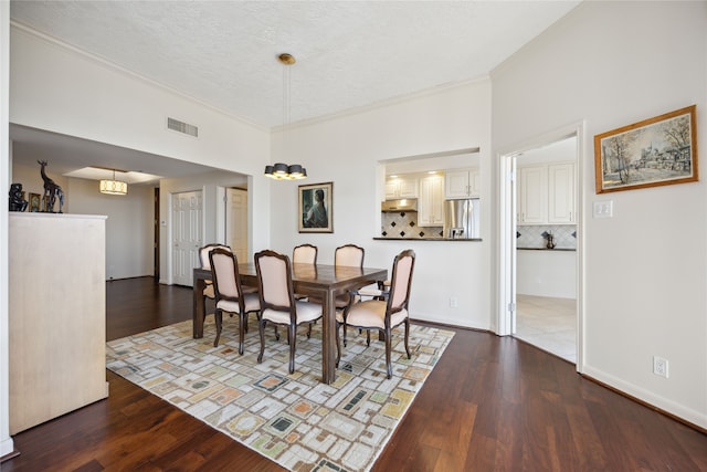 tiled dining room with a textured ceiling