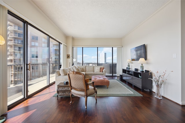 living room featuring hardwood / wood-style floors, crown molding, and a textured ceiling