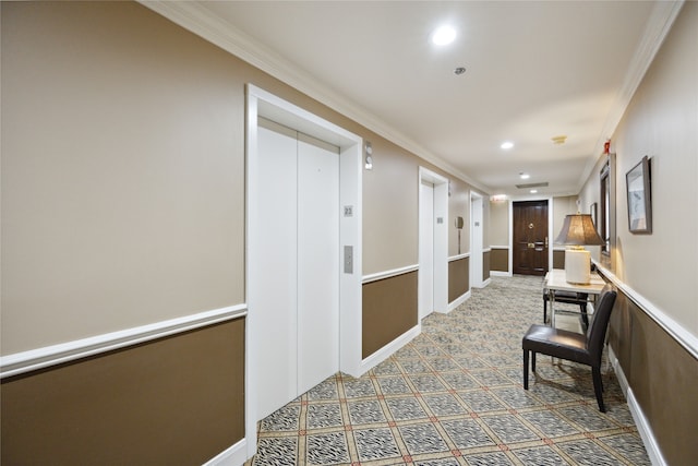 corridor with elevator and ornamental molding