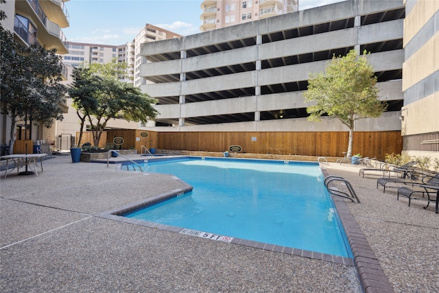 view of swimming pool with a patio