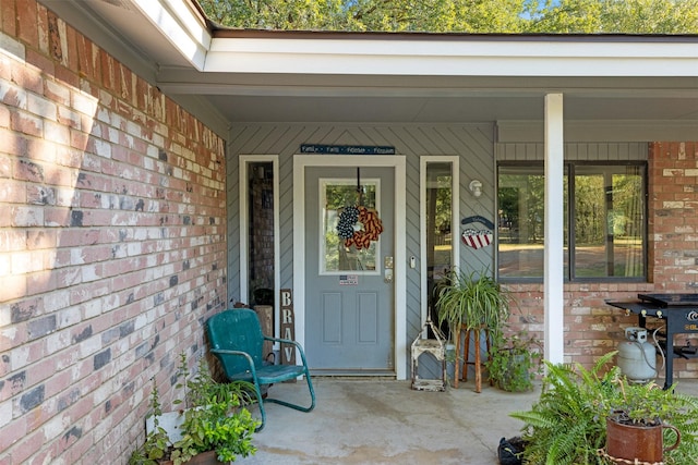 130 Green Acres Loop, Bastrop, TX 78602 - property entrance with brick siding and a porch