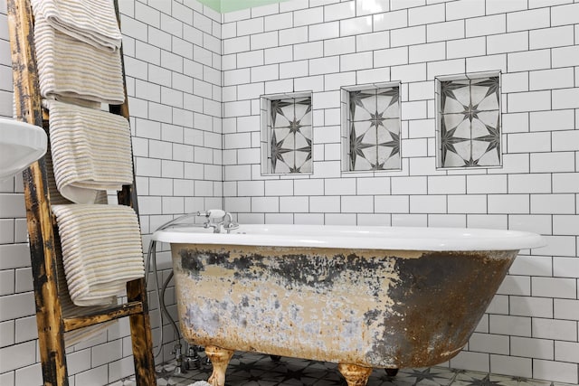 130 Green Acres Loop, Bastrop, TX 78602 - bathroom featuring tile walls and a soaking tub