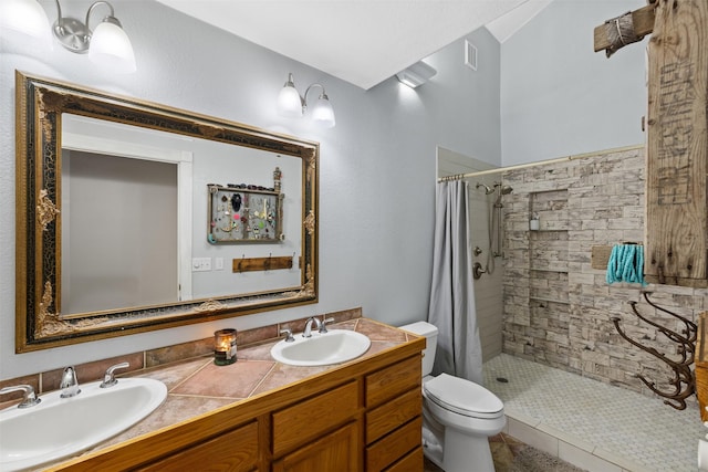 130 Green Acres Loop, Bastrop, TX 78602 - bathroom with toilet, visible vents, tiled shower, and a sink