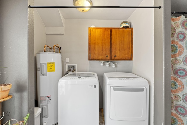 130 Green Acres Loop, Bastrop, TX 78602 - laundry area featuring water heater, cabinet space, and separate washer and dryer