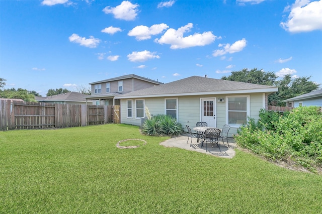 rear view of property with a patio area and a lawn