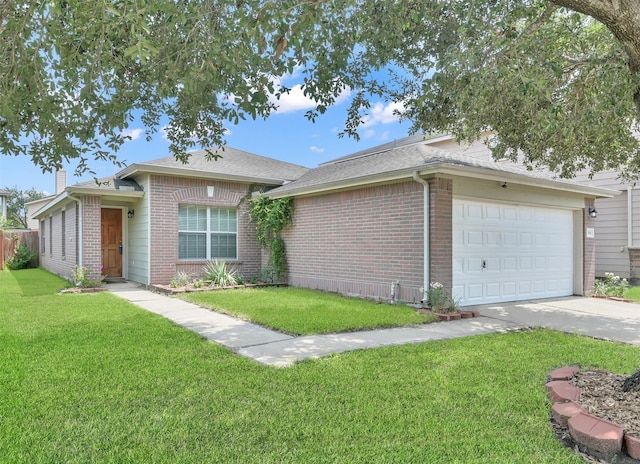 ranch-style home with a garage and a front lawn