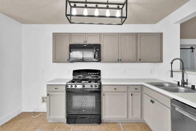 kitchen featuring sink, light tile patterned flooring, and black appliances