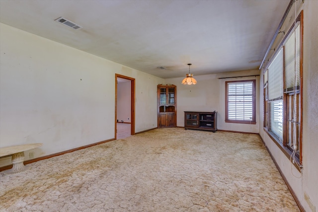 unfurnished living room with carpet flooring