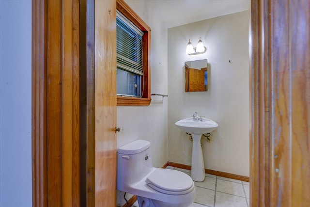 bathroom featuring tile patterned flooring and toilet