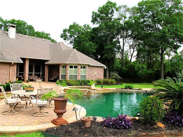 view of pool featuring a patio