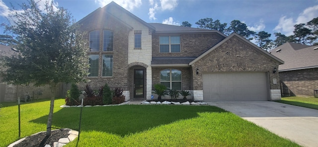 view of front of home featuring a front lawn and a garage