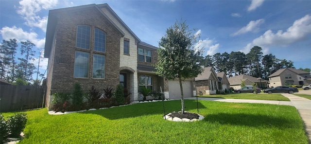 view of front of home featuring a front yard and a garage