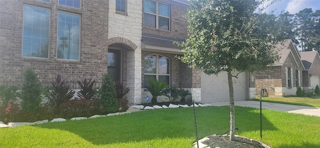 view of front facade with a garage and a front yard