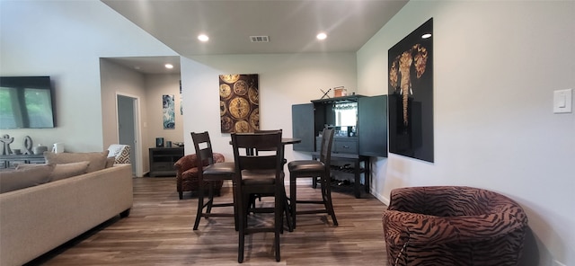 dining space with hardwood / wood-style floors