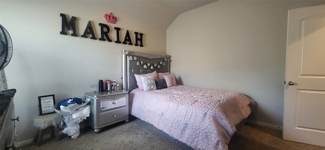 bedroom featuring vaulted ceiling and carpet