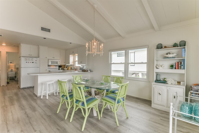 dining room with a wealth of natural light, visible vents, vaulted ceiling with beams, and light wood-style flooring