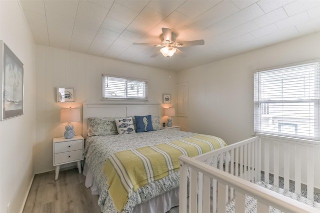 bedroom featuring ceiling fan and wood finished floors