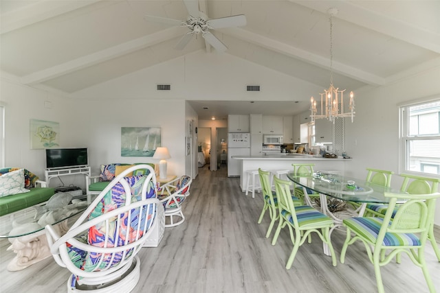 dining area with beamed ceiling and visible vents