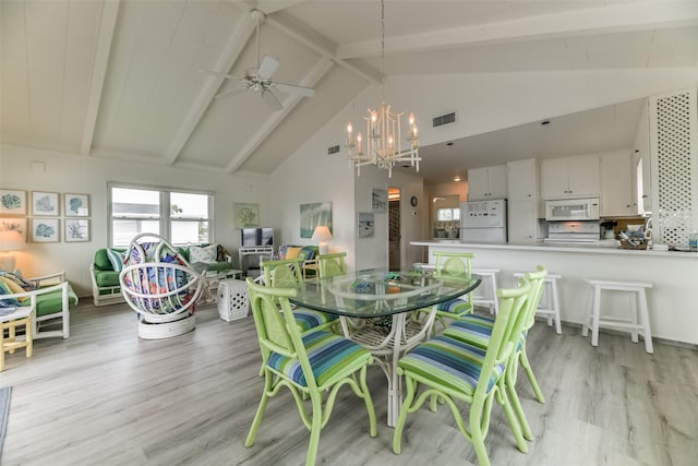 dining space with high vaulted ceiling, light wood-style flooring, visible vents, and beam ceiling