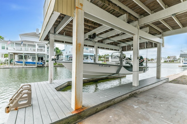 view of dock featuring a water view and boat lift