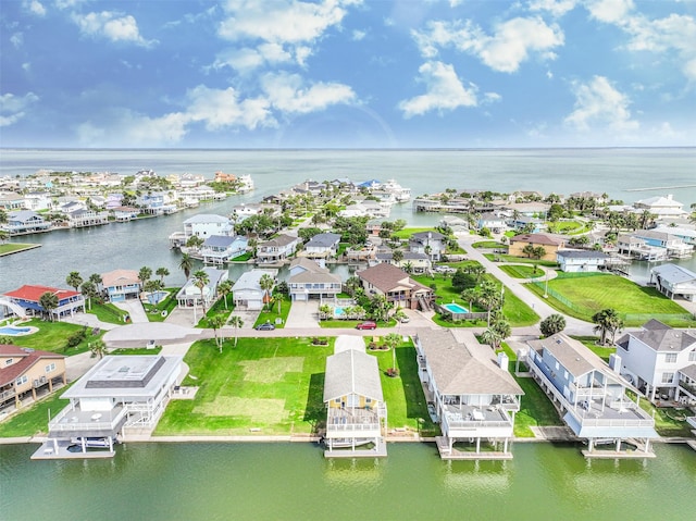 drone / aerial view featuring a water view and a residential view