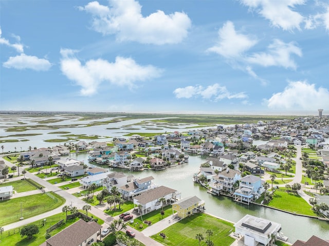 aerial view featuring a residential view and a water view