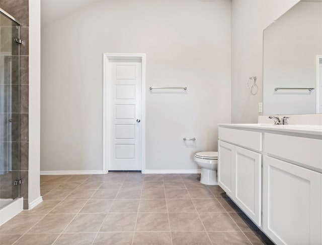 bathroom featuring tile patterned floors, a shower with shower door, vanity, and toilet