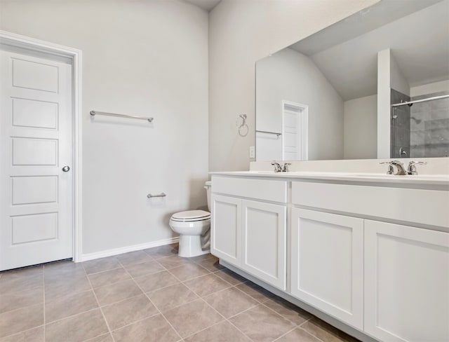 bathroom with a shower with door, toilet, tile patterned floors, and vanity