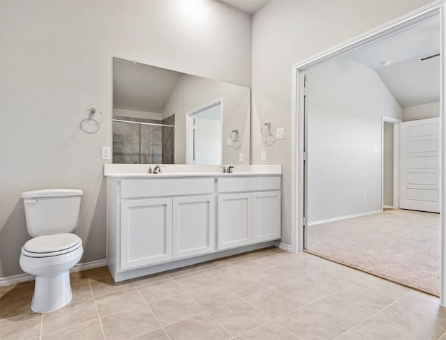 bathroom featuring toilet, tile patterned flooring, vanity, vaulted ceiling, and a shower with shower door