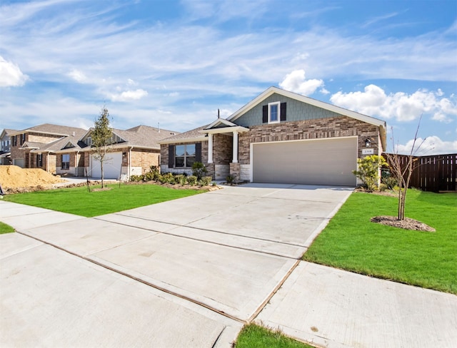 view of front of house featuring a garage and a front lawn