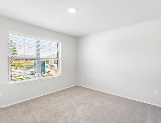 empty room featuring light colored carpet