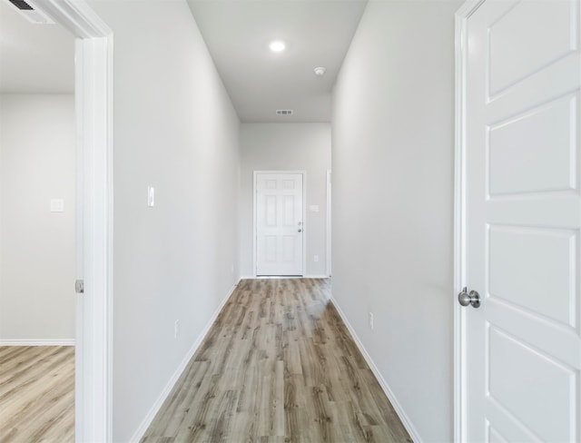 hallway featuring light hardwood / wood-style flooring