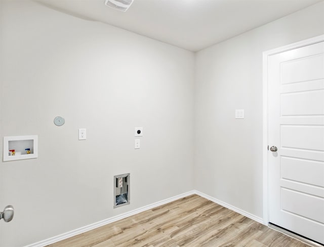 laundry room with light wood-type flooring, hookup for a washing machine, and hookup for an electric dryer