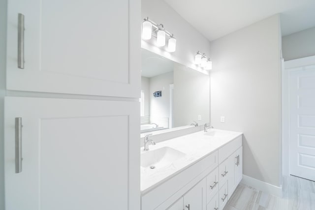 bathroom featuring a bath and vanity