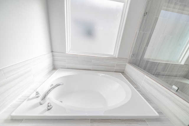 bathroom featuring a tub