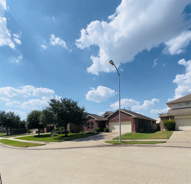 ranch-style house with a garage and a front lawn