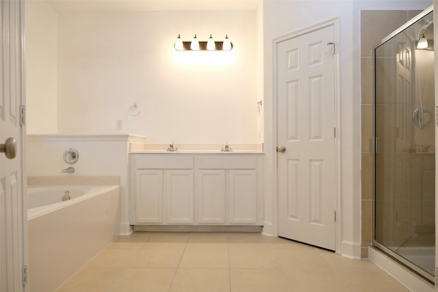 bathroom featuring vanity, tile patterned floors, and separate shower and tub