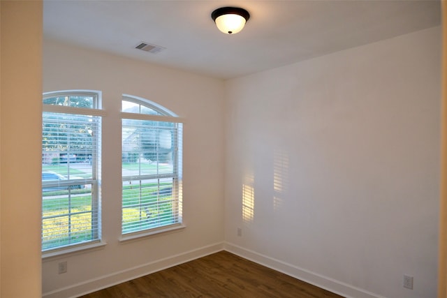 empty room featuring dark hardwood / wood-style floors