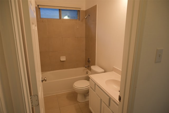 full bathroom featuring toilet, tiled shower / bath combo, vanity, and tile patterned floors