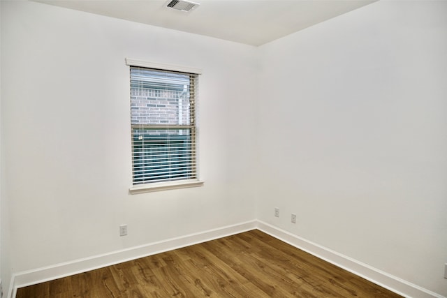 unfurnished room featuring hardwood / wood-style floors