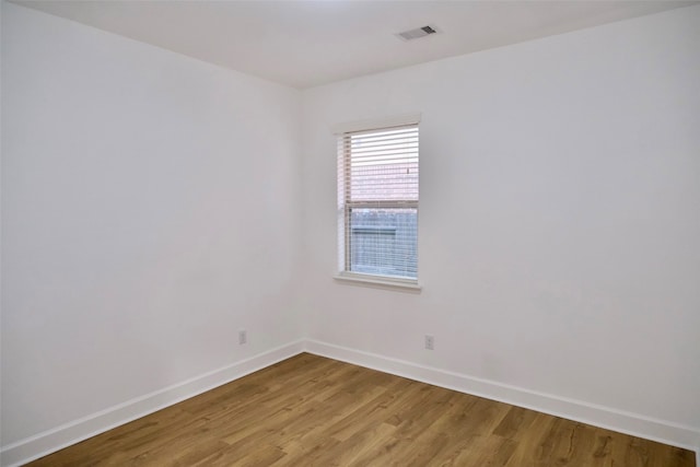 unfurnished room featuring light hardwood / wood-style floors