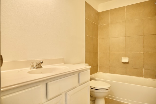 full bathroom featuring vanity, toilet, and tiled shower / bath