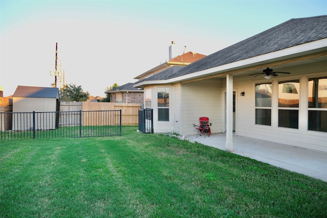 view of yard with a patio and ceiling fan