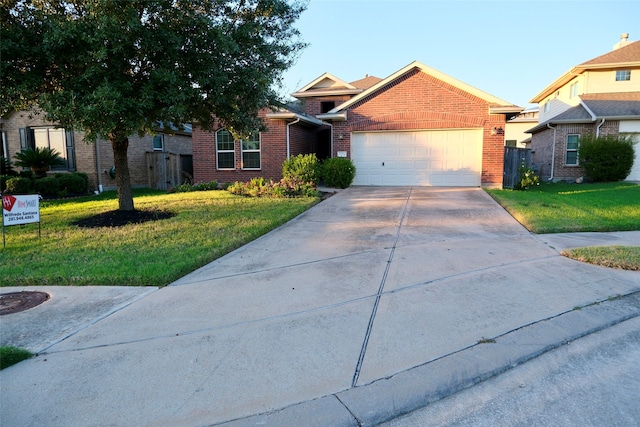 view of front of house with a garage and a front yard