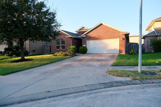 view of front of home with a garage and a front yard